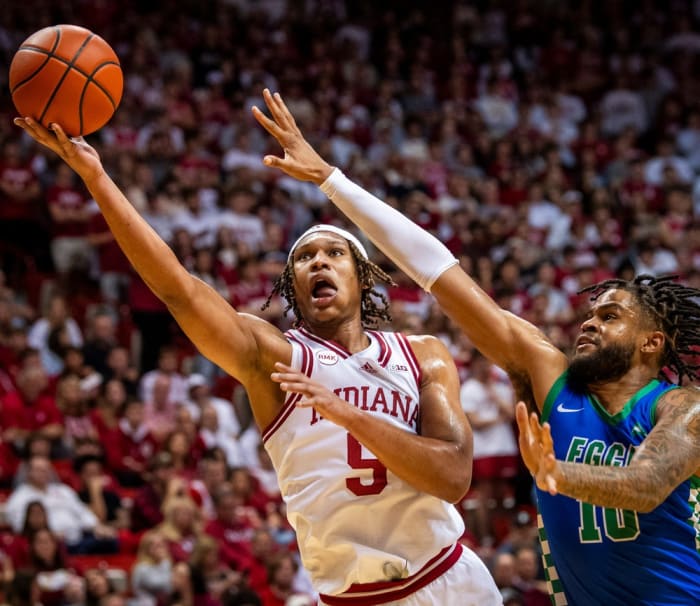 Indiana's Malik Reneau (5) scores past Florida Gulf Coast's Zach Anderson (10) during the second half of the Indiana versus Florida Gulf Coast men's basketball game at Simon Skjodt Assembly Hall on Tuesday, Nov. 7, 2023.